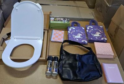 a white toilet and a black bag on a table