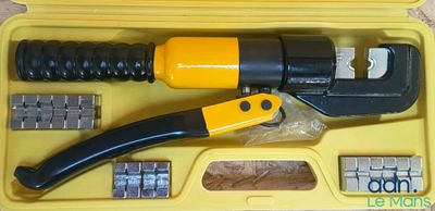 a yellow case with tools in it on a table