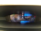 the dashboard of a car with a digital display on it