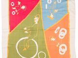 a close up of a colorful scarf with a bird on a bike