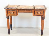 a small wooden table with two drawers on it
