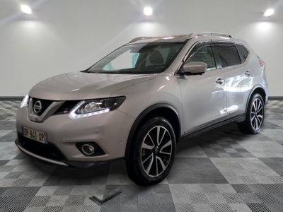 the silver nissan suv is parked on a checkered tile floor