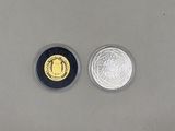 a close up of a coin and a coin with a picture on it