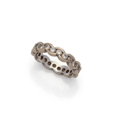 a close up of a diamond ring on a white background
