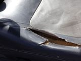 a hole in the seat of a car that has been damaged