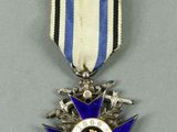an image of a blue and white medal with a star on it