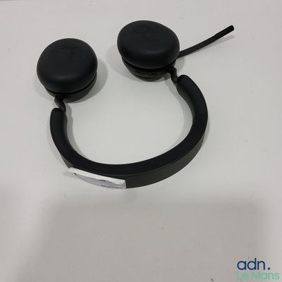a pair of black headphones on a white table