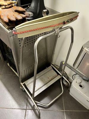 a kitchen with a stove and a rack with food on it