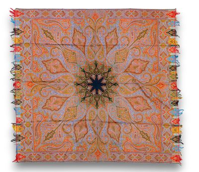 an orange and blue square rug with a star design on it