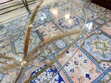 a glass table with a glass top on a tiled floor