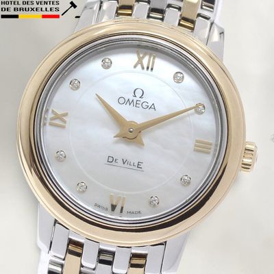 an image of a close up of a wrist watch with roman numerals