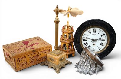 a clock that is sitting next to a box and a clock