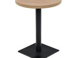 a round wooden table with a black metal base