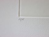 a white wall with a small square on it