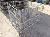a metal cage that is sitting in the dirt