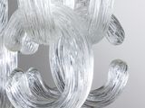 a close up of a glass chandelier hanging from a ceiling