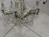 a chandelier that is sitting on a tile floor