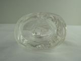 a clear glass object on a table with a white background