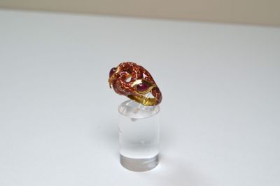 a small glass with a piece of chocolate in it