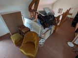 a view of a living room with a couch and a chair
