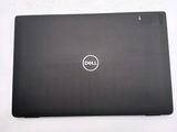 the dell laptop is sitting on a table with a white background
