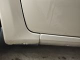 a white car that has a flat tire on it