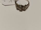 a close up of a ring on a table with a price tag