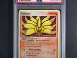 a close up of a pokemon card on a black surface