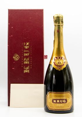 an image of a bottle of champagne next to a red box