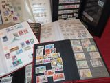a lot of stamps on a table with a book