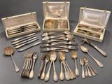 an assortment of silverware including forks, spoons, and spoons