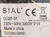 the label on the back of a black car shows the date of the vehicle