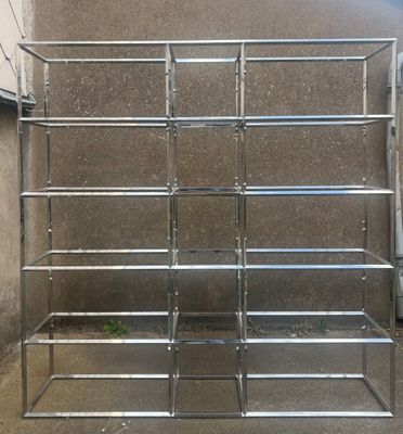 a metal shelf that has a lot of shelves on it