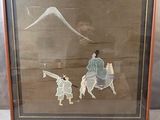 tableau encadré représentant un homme à cheval en compagnie d'une femme et d'un enfant