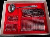 a red tray with silverware and spoons in it