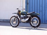 a motorcycle that is parked in front of a building