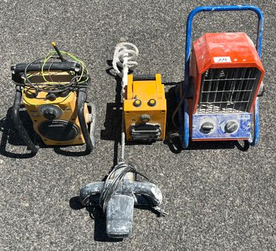 two small machines that are sitting on the ground
