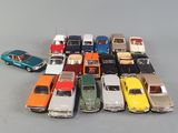 a lot of toy cars that are sitting on a table