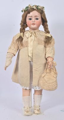 an image of a doll with a hat and a purse
