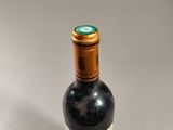 a bottle of wine that is sitting on a table