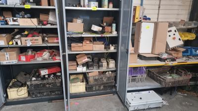 many boxes and boxes on the shelves in the garage