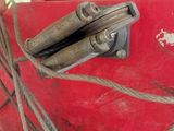a close up of a red boat with a rope on it