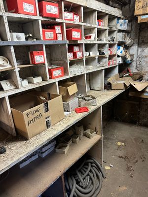 a room with a lot of boxes and boxes on the shelves
