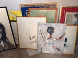 many framed pictures of a woman on the floor