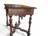 a small table with a wooden top on a white background