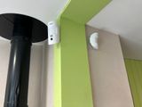 an image of a black and white stove in a green room