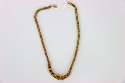 a gold chain necklace with a heart shaped clasp on a white background