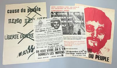 several posters are displayed on the wall of a room