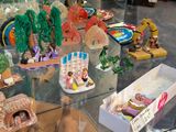 a glass table with a lot of figurines on it