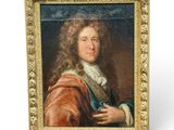 un vieux tableau représentant un homme aux cheveux longs, dans un cadre doré